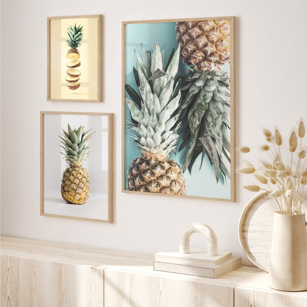 Pineapples on Teal - Art Print, Poster, Stretched Canvas or Framed Wall Art, shown framed in a home interior space