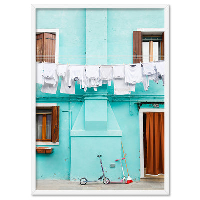 Turquoise Terrace Washing Burano - Art Print by Victoria's Stories, Poster, Stretched Canvas, or Framed Wall Art Print, shown in a white frame