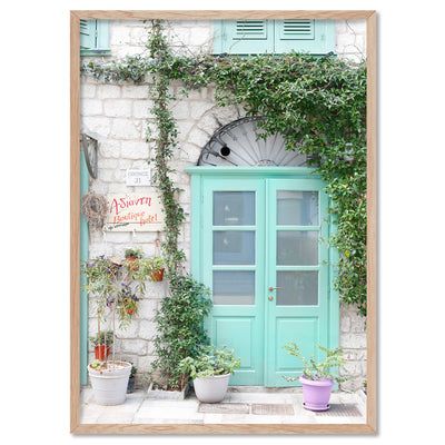 Pastel Door in Greece III - Art Print by Victoria's Stories, Poster, Stretched Canvas, or Framed Wall Art Print, shown in a natural timber frame